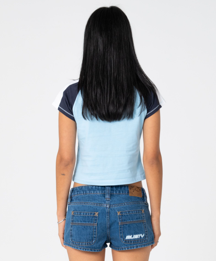 Rusty Bradley Mini Cap Sleeve Women's T-Shirt in light blue with navy sleeves on model from the back