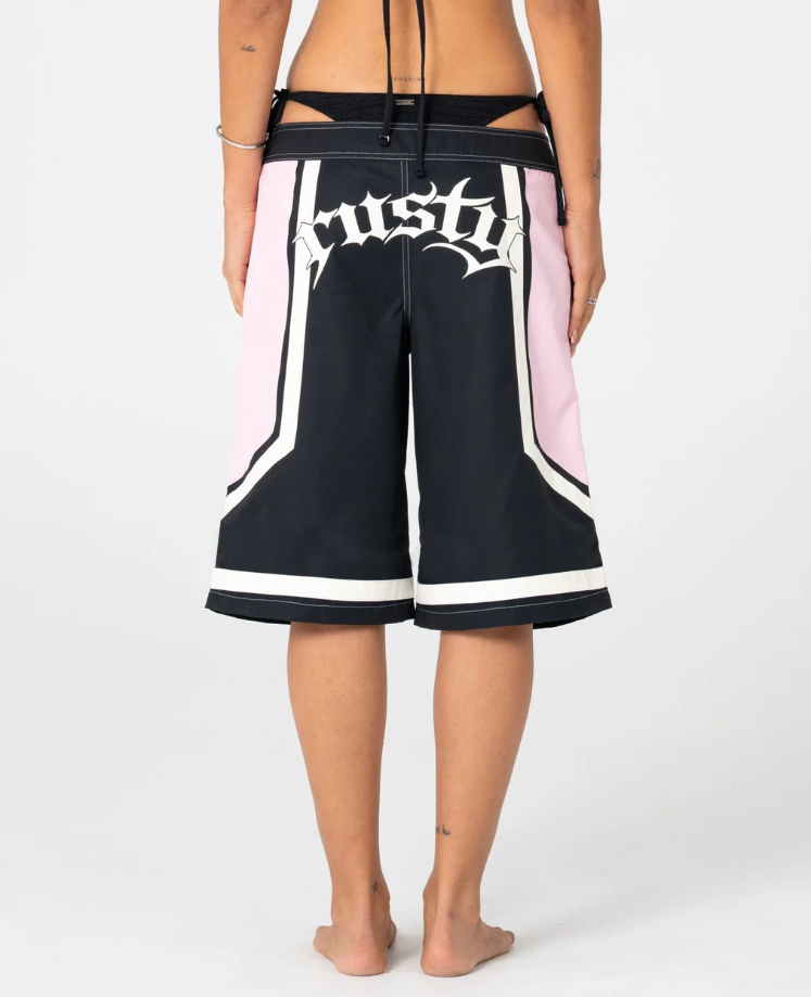 Rusty Farrah Long Women's Boardshorts in black and pink on model from rear close up