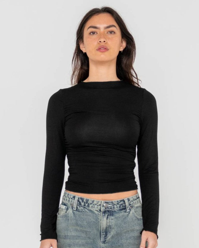 Rusty Plain Jane Ruched Long Sleeve Top in black from front on model