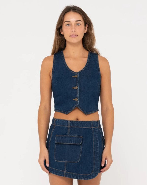 Rusty Ryley Cropped Button Down Denim Vest in deep blue on model from front