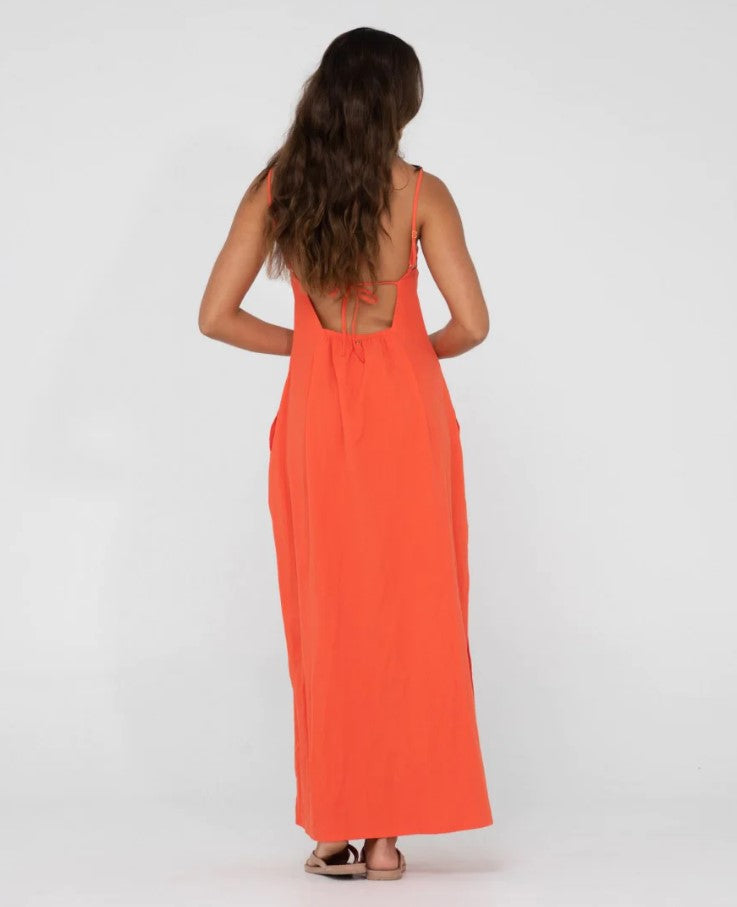 Rusty Sicily Shirred Maxi Dress  in radiant red on model from back