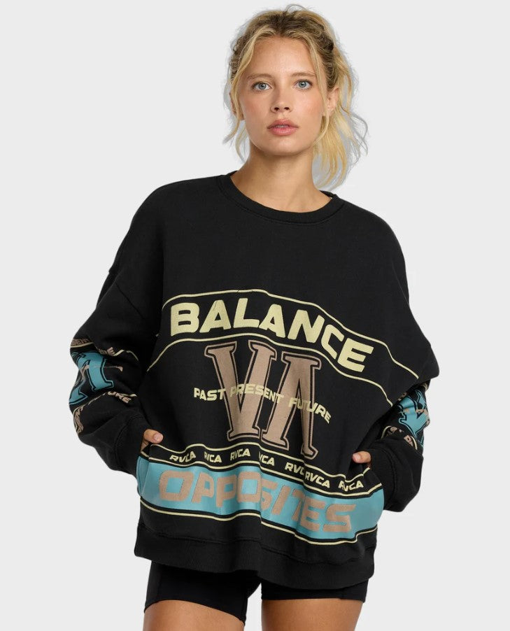 RVCA Puck It Pullover Crew Womens Sweatshirt in black on blonde model from front