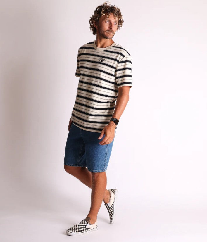 Town and Country Nomad Stripe Mens T-Shirt in boen with black stripe on model wearing denim shorts