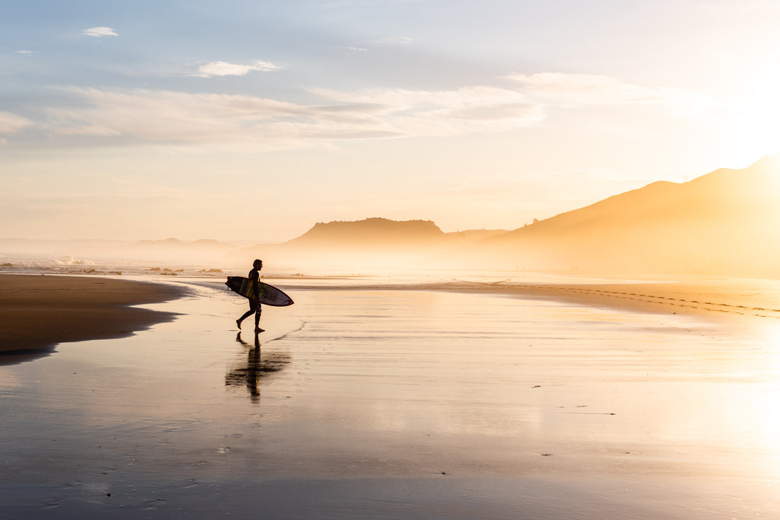 Lone surfer on Makorori Beach in Gisborne