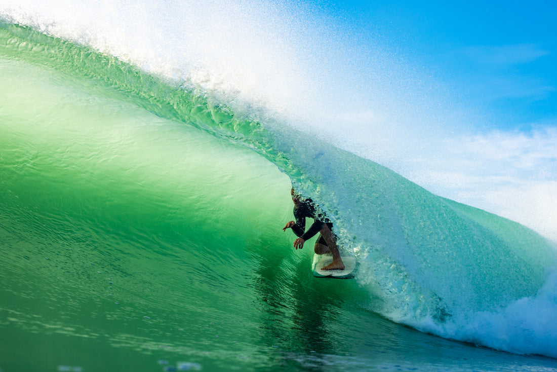 Beautiful clear photo showing Bobby Hansen surfing in a barrel at Wainui Beach GIsborne