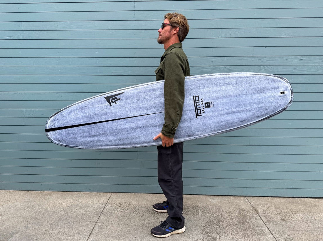 Daniel Tomo Thomson with Revo Max surfboard in Volcanic construction