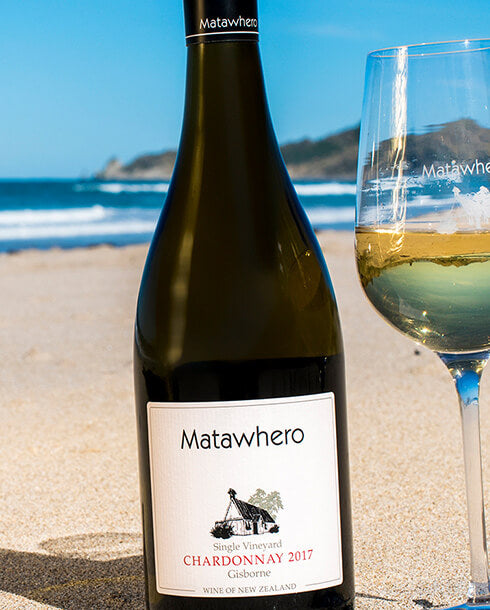 Bottle of Matawhero Wines Gisborne CHardonnay 2017 taken on the beach