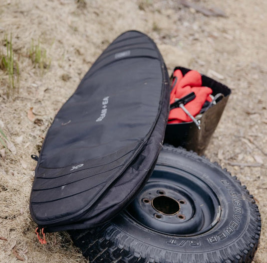 Ocean and Earth HYPA single boardbag sitting on tyre outside