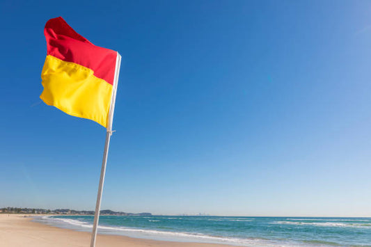 Surflifesaving patrol flag at the beach