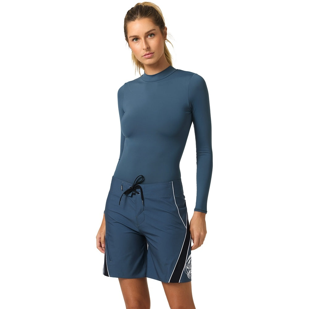 O'Neill Y2K Superfreak 7" Women's Boardshorts in slate colourway on model wearing a slate blue rash shirt from the front