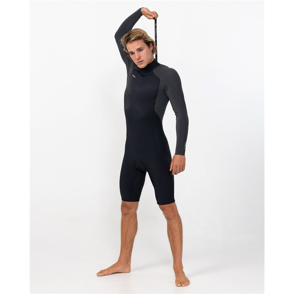 O'Neill Hyperfreak 2mm BZ GBS Long Sleeve Wetsuit in black and steel on model from the front with him pulling up the back zip