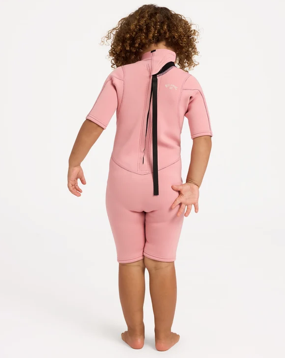 Billabong 2/2mm Absolute Spring Toddler Wetsuit in french rose colourway on model from the back