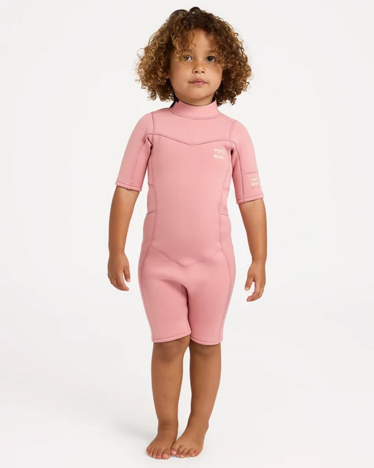 Billabong 2/2mm Absolute Spring Toddler Wetsuit in french rose colourway on model from the front