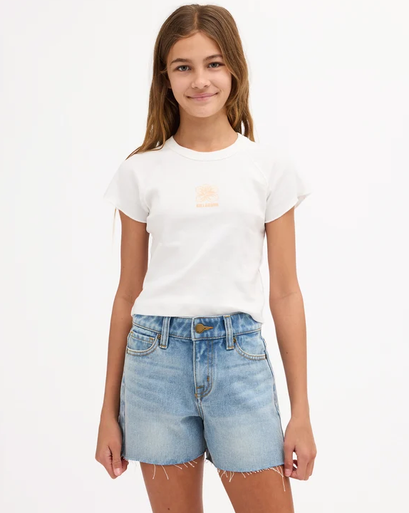 Billabong Miley Girls (8-16) Denim Short in faded indigo colourway on teen model in white Billabong tee