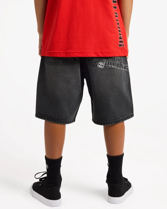 Billabong Spec 73 Boys (8-16) 19" Denim Shorts in black on model with red Billabong t-shirt on from the back
