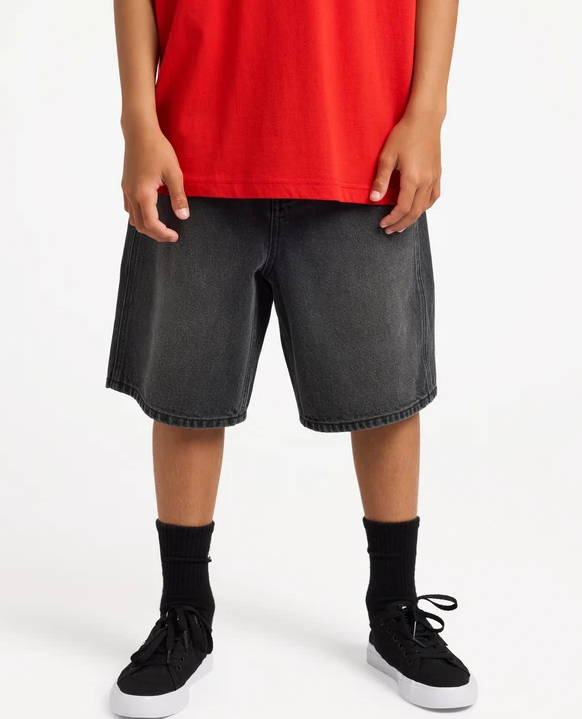 Billabong Spec 73 Boys (8-16) 19" Denim Shorts in black on model with red Billabong t-shirt on from the front close up