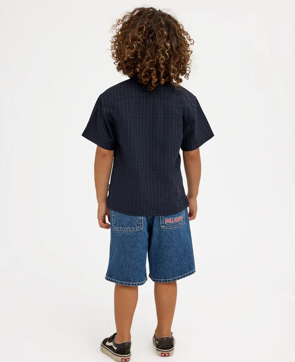 Billabong Spec 73 Groms (2-7) Denim Shorts in ocean wash blue colourway on kid in checked shirt from the back