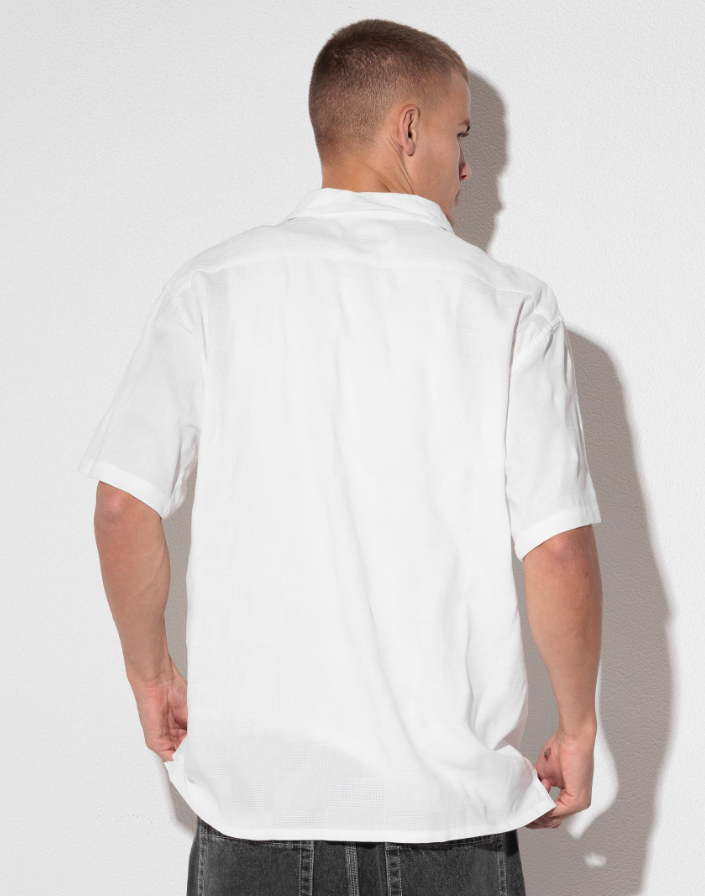 Billabong Sundays Jacquard Short Sleeve Shirt in white on model in black denim shorts from the back