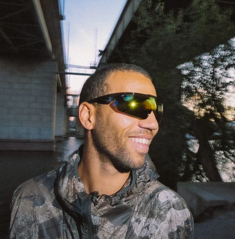 CHPO Brand Soda Sunglasses in black with red mirror lenses on model under two ridges