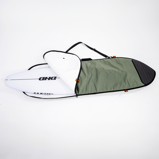 FCS Go-Light 6'3 Classic Fish Cover in alpine and black showing board going into it