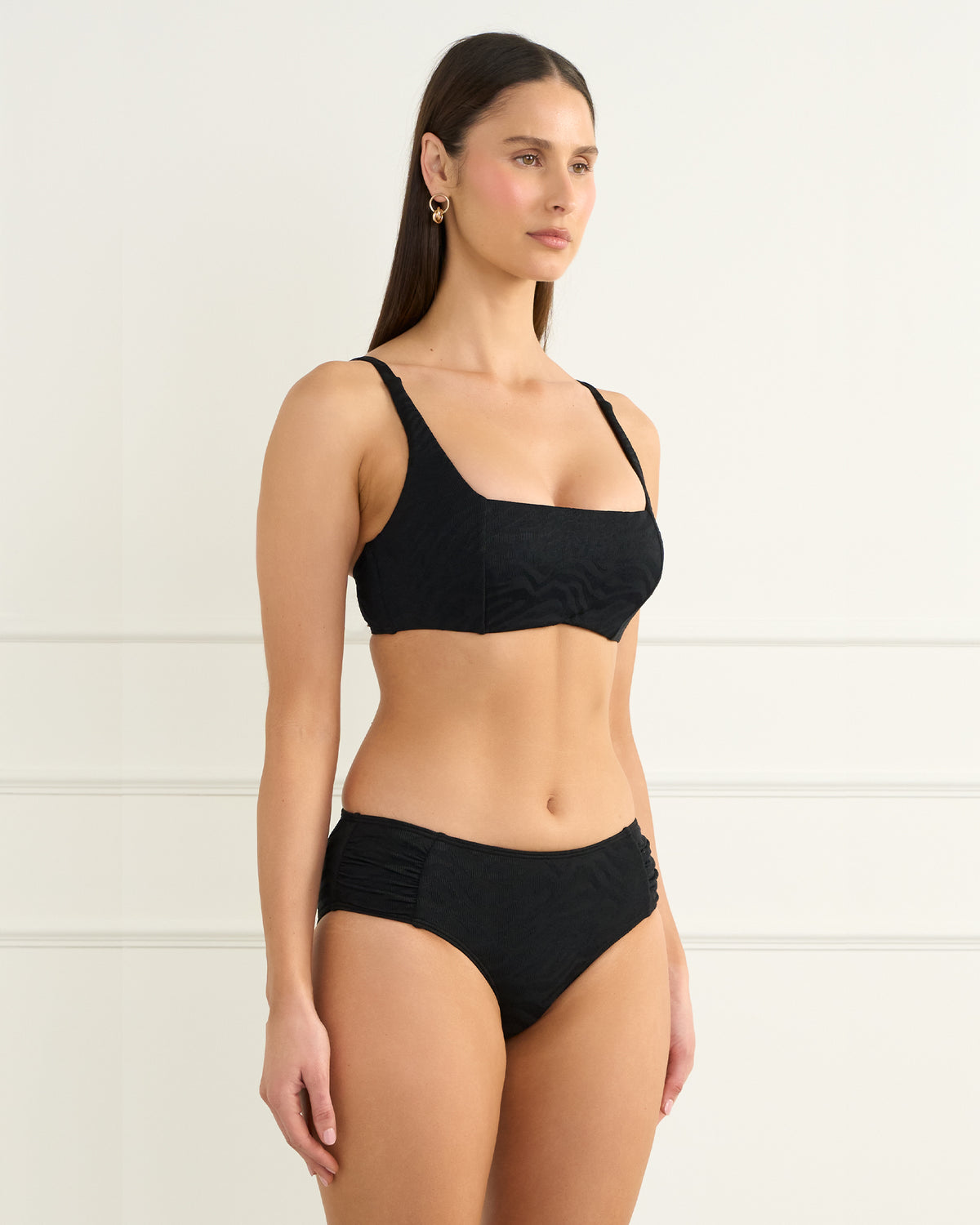 Heaven Swimwear Sophia Crop with Emma Surf Pant Bikini in black on model from the side close up