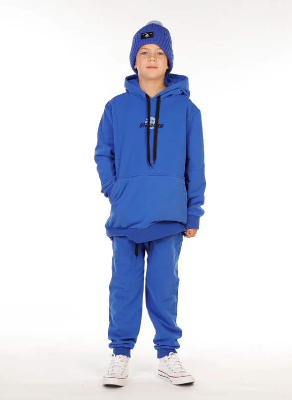 Hello Stranger Smiley Boys Pocket Hoodie in blue on model in blue hello stranger trackpants from the front