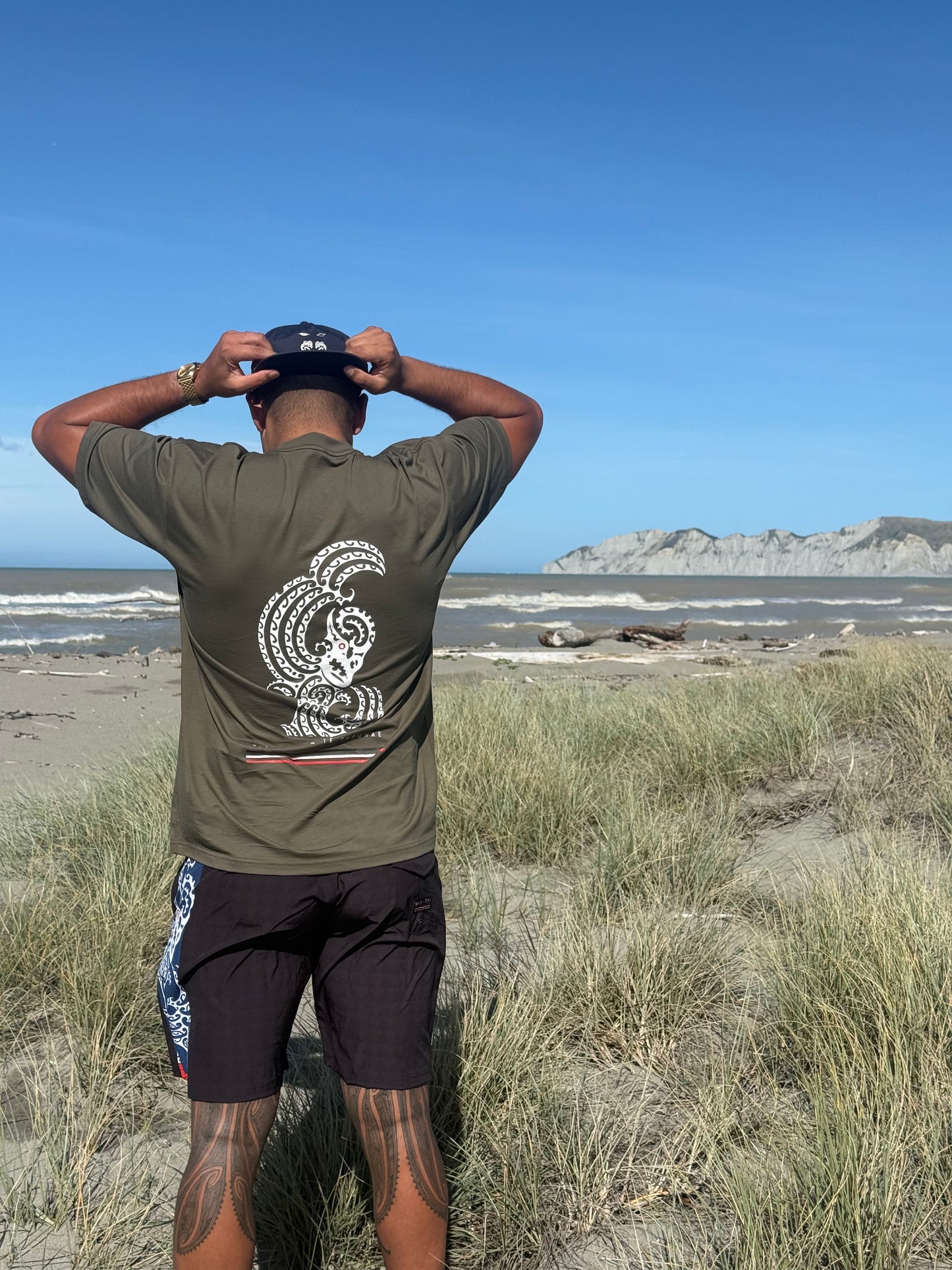 Wai-Tai Aotearoa Mens Taniwha Tee in dark olive from rear