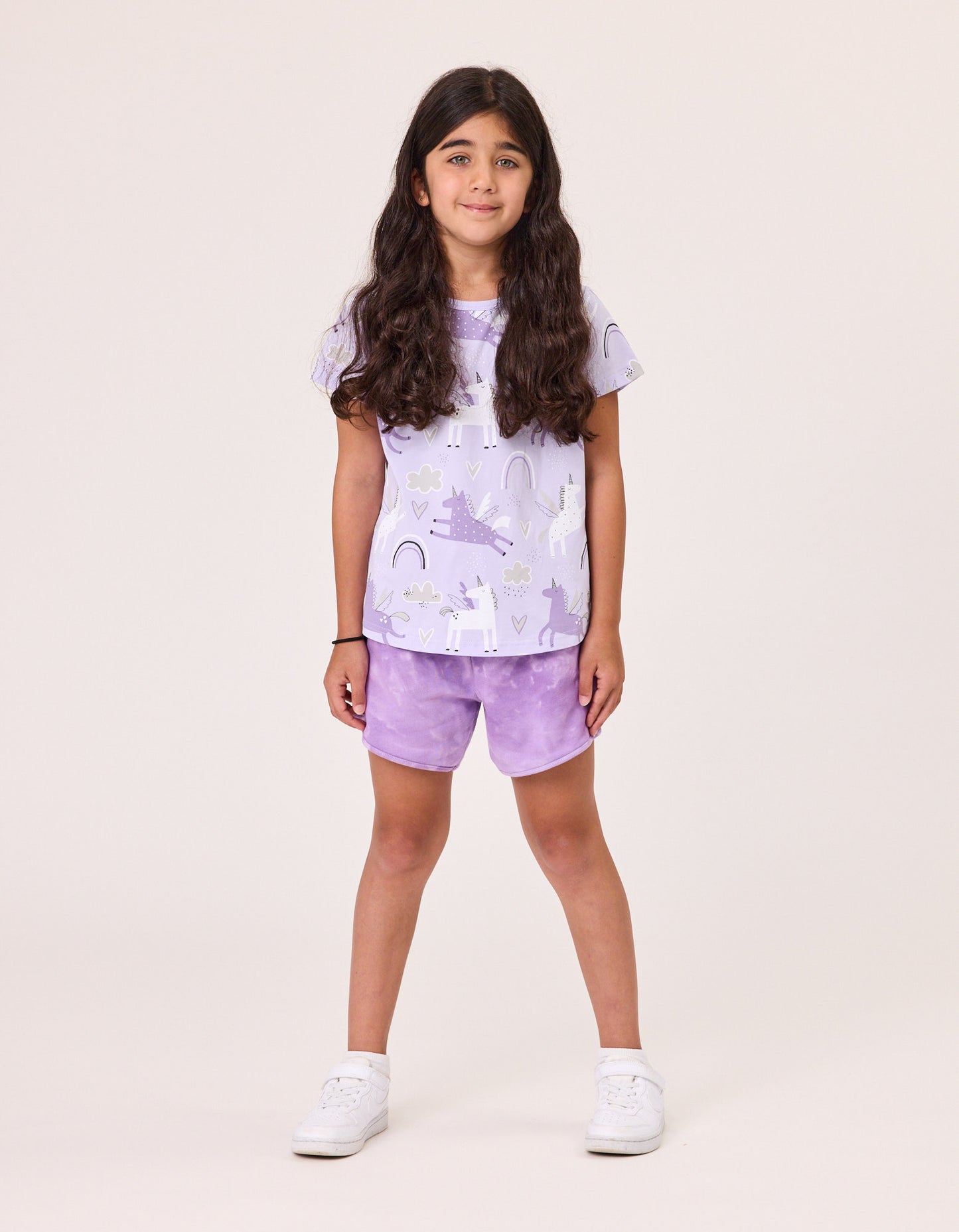Kissed By Radicool Magical Unicorns T-Shirt in purple with unicorn print on model from the front