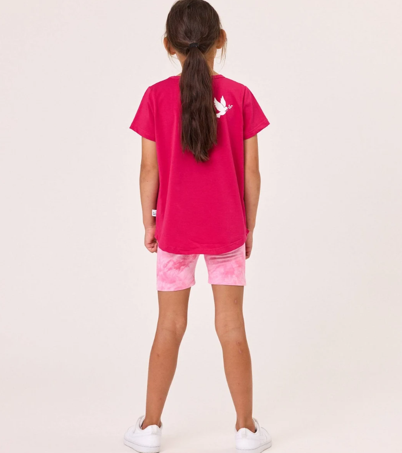 Kissed By Radicool Bike Short Tie Dye Pink on model in pink tee from the back