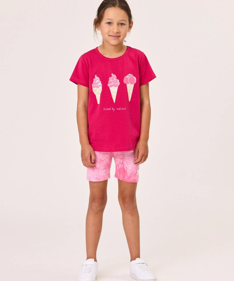Kissed By Radicool Bike Short Tie Dye Pink on model in pink tee with ice creams on it from the front