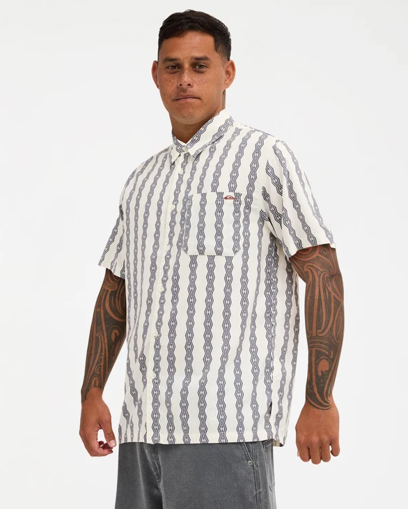 Quiksilver Tai Kehu Tohu Men's Maori Short Sleeve Shirt in birch colourway on Kehu Butler from the front on left side angle