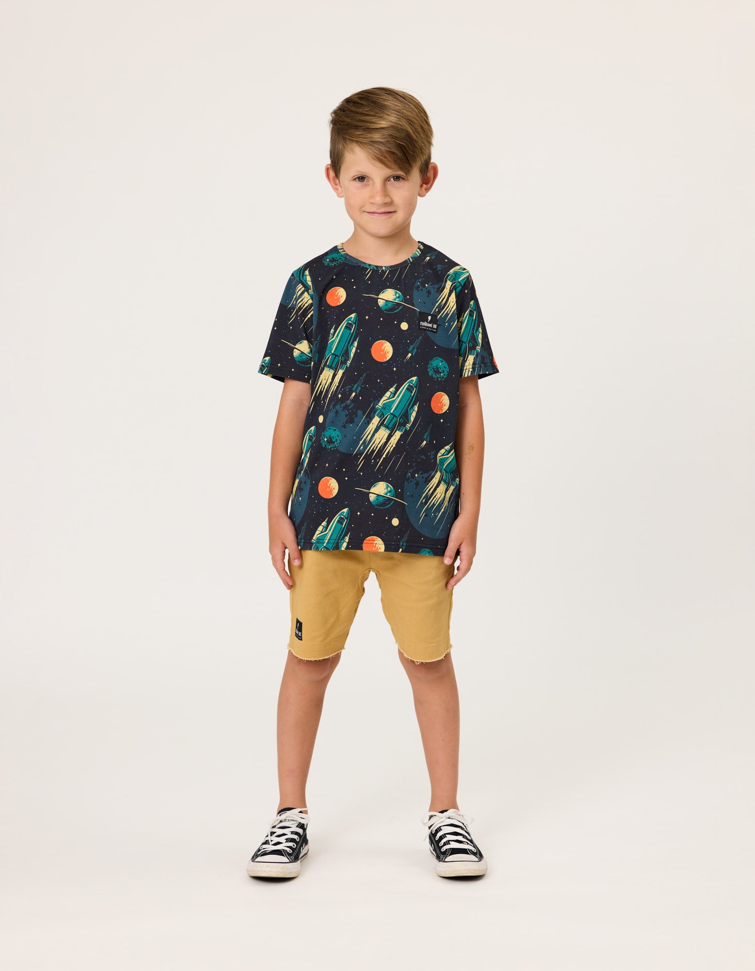 Radicool Kids Rockets Boys T-Shirt  on model in khaki coloured shorts from front