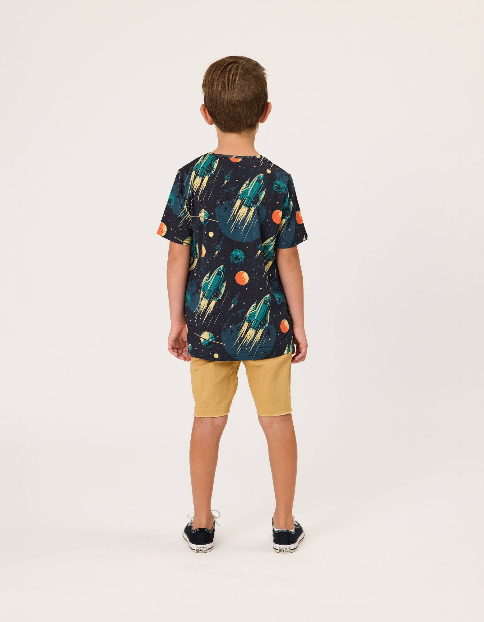 Radicool Kids Rockets Boys T-Shirt  on model in khaki coloured shorts from  rear