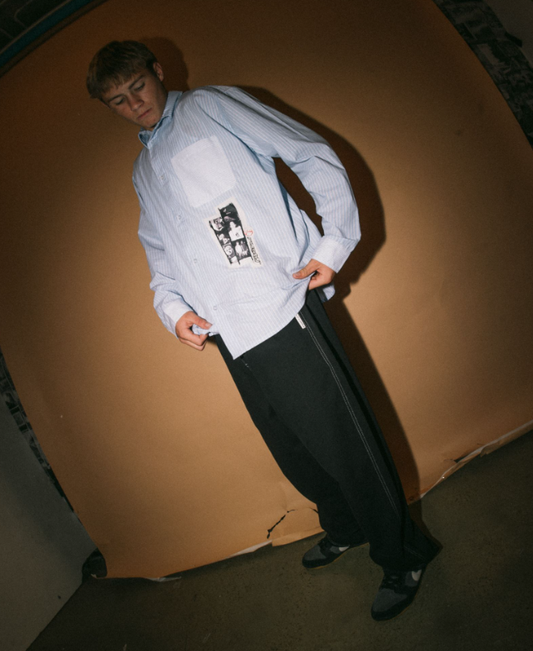 Rusty Flip Daddy Elastic Pants in black on model in white shirt from front