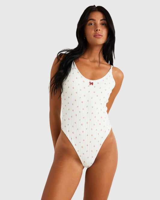 RVCA Rose Bud One Piece Swimwear in white with roses on dark haired model from front