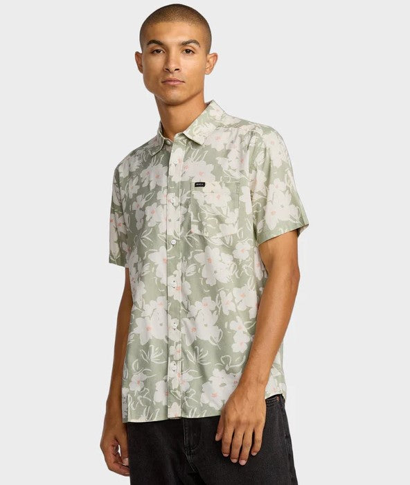 RVCA Sunup Short Sleeve Shirt in light olive floral on model from front on side view