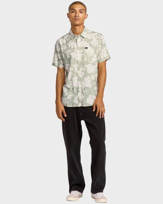 RVCA Sunup Short Sleeve Shirt in light olive floral on model in black jeans