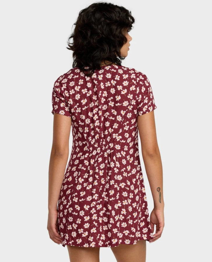 RVCA Understated Dress  in a cranberry based floral colourwat on dark haired model from the rear