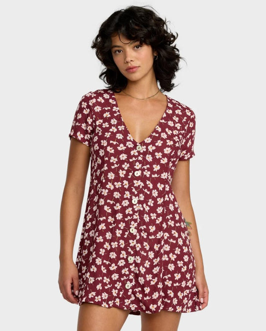 RVCA Understated Dress  in a cranberry based floral colourwat on dark haired model from the front