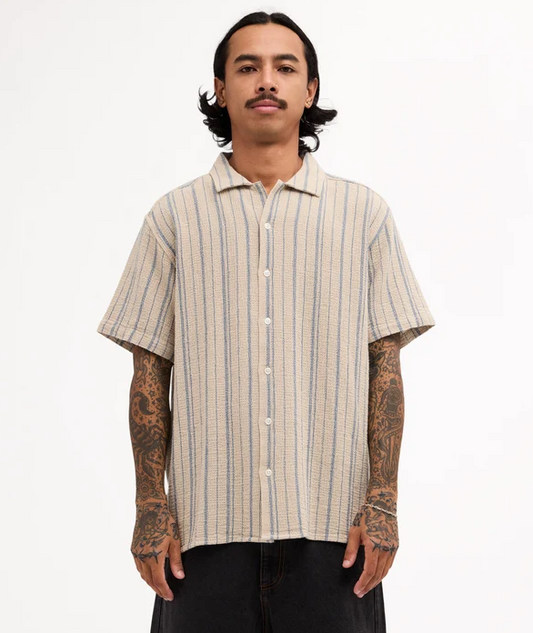 RVCA Vacancy Stripe Short Sleeve Shirt
  in light khaki on model from front