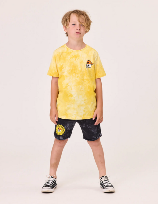Radicoool Kids Tie Dye Skater Tee in tie dye yellow on model from the front