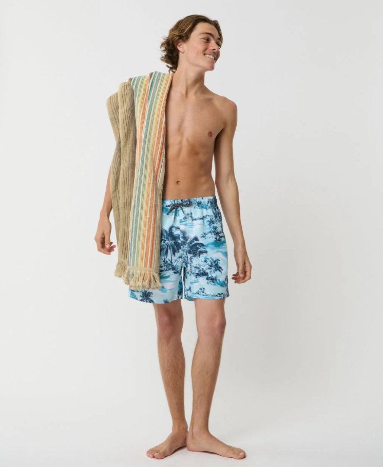 Rip Curl Dreamers 16" Men's Volley Shorts in blue on model with towel over his shoulder