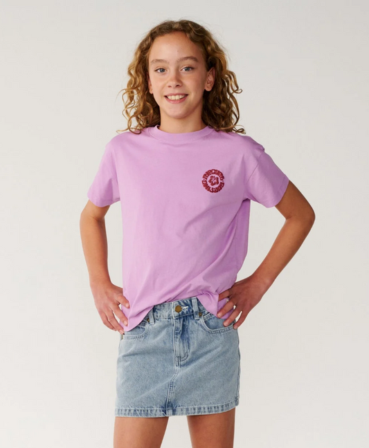 Rip Curl Surf Puff Relaxed Girls Tee
 in bright lilac colourway on young model in denim skirt from the front