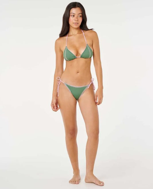 Rip Curl Stephanie Gilmore Sliding Tri w Tie Side Pant Bikini Set in dark green with pink trim on model from front