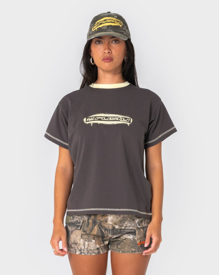 Rusty Punked Relaxed Women's T-Shirt in ultimate grey colourway on model in camo Rusty cap and shorts