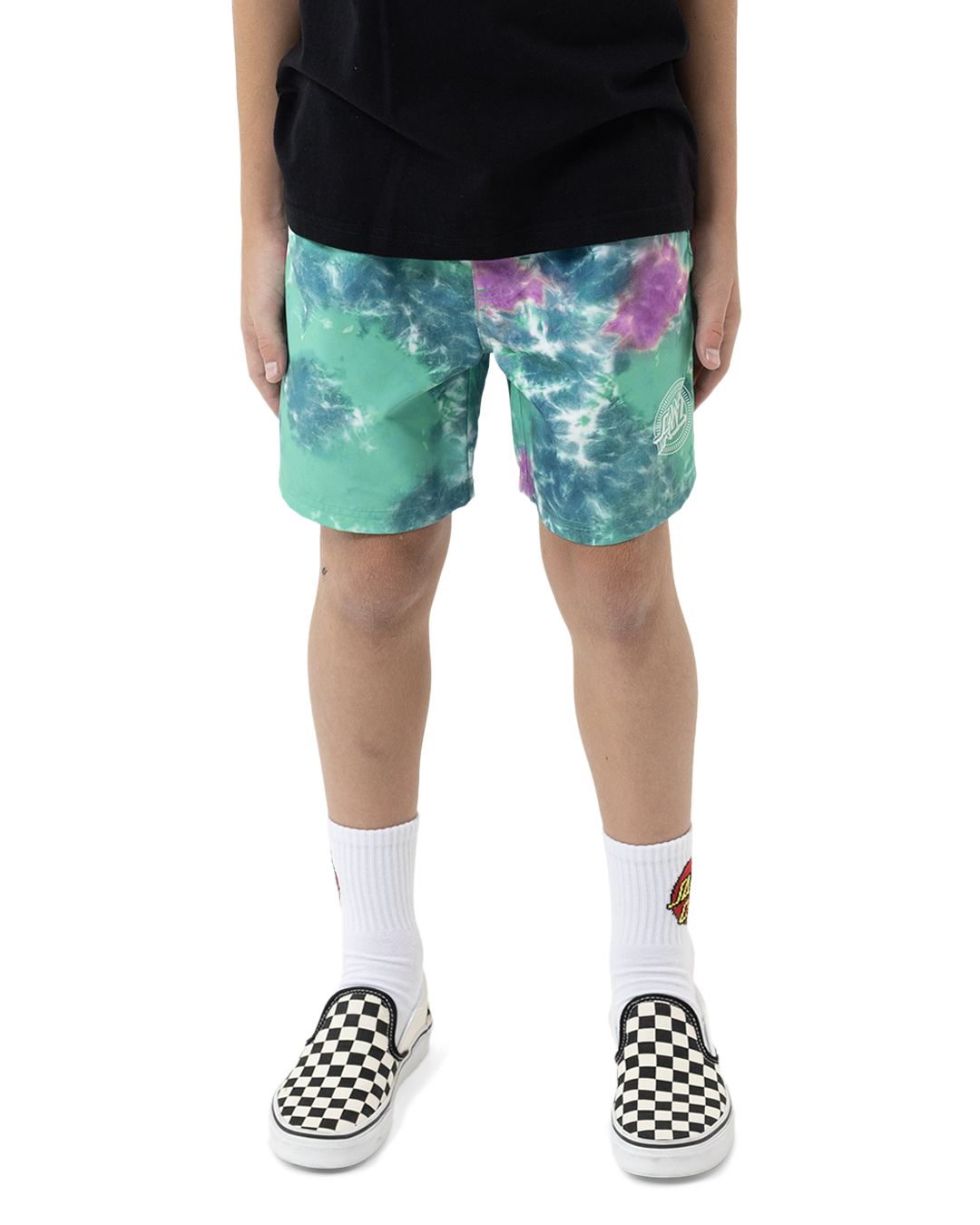 Person wearing tie-dye shorts with a white background