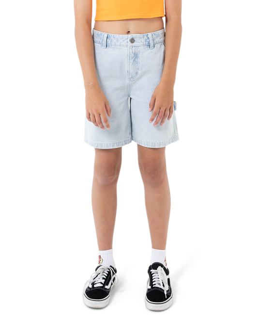 Person wearing light blue denim shorts on a white background