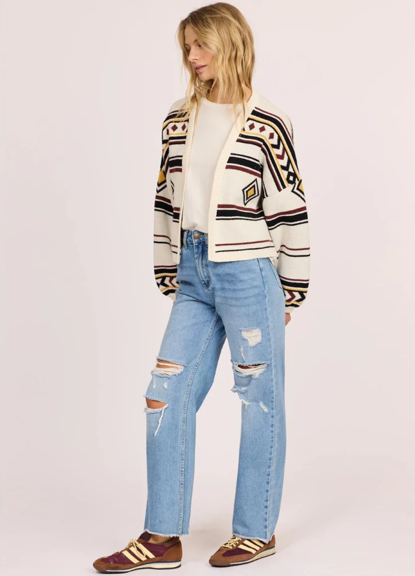 Sisstrevolution Ibiza Island Sweater in sea salt colourway on model in blue jeans from front/side view