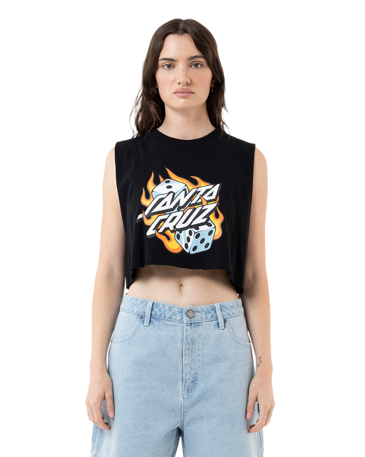 Woman wearing a black sleeveless crop top with a graphic design and light blue jeans on a white background