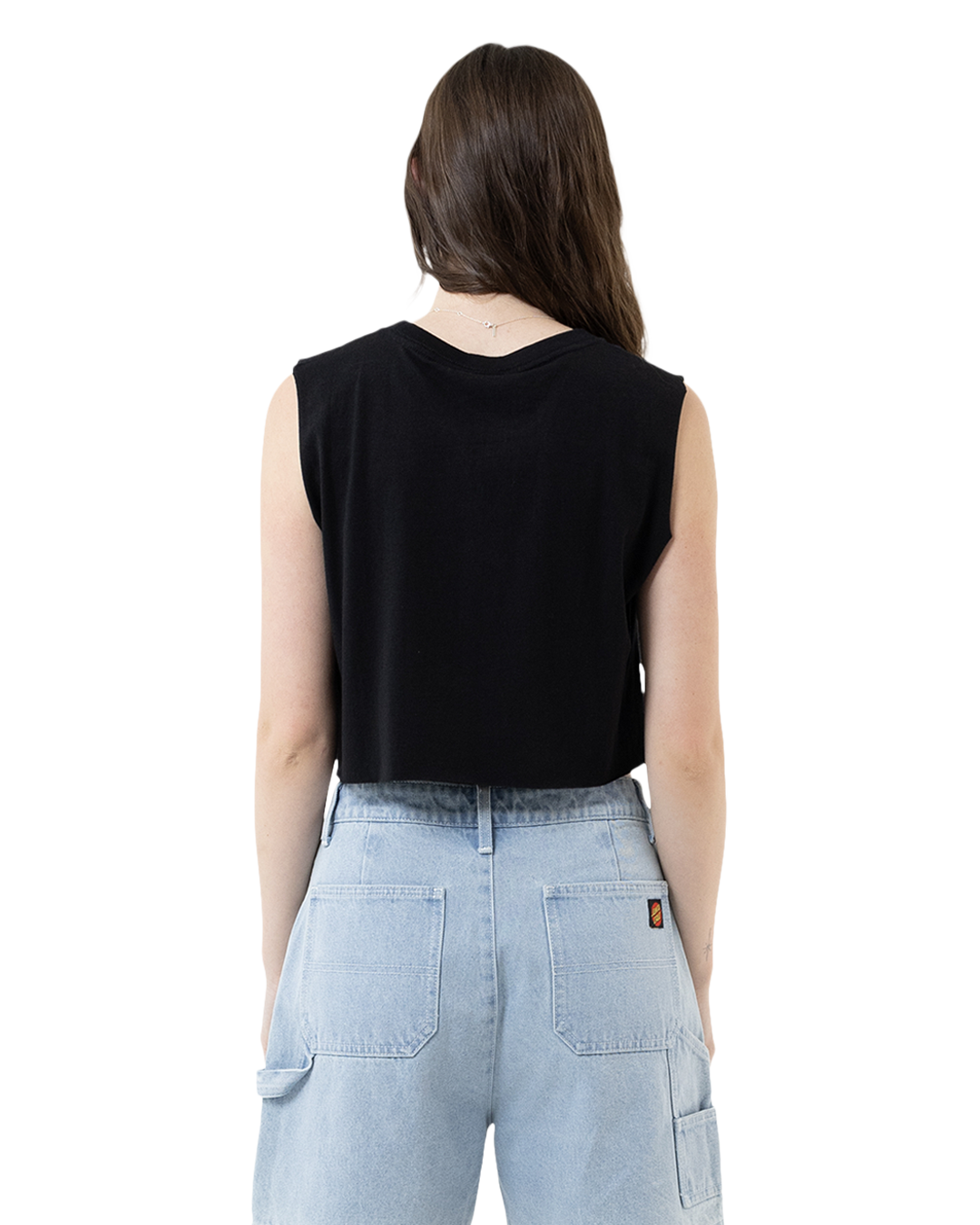 Person wearing a black sleeveless top and light blue jeans on a white background